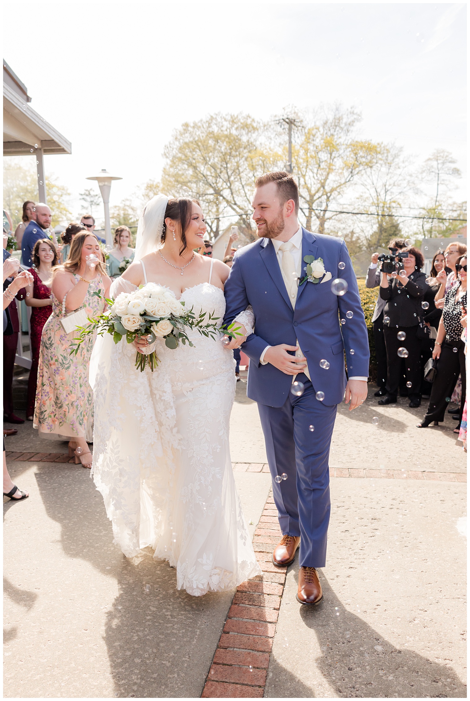 bride and groom walking outside the church