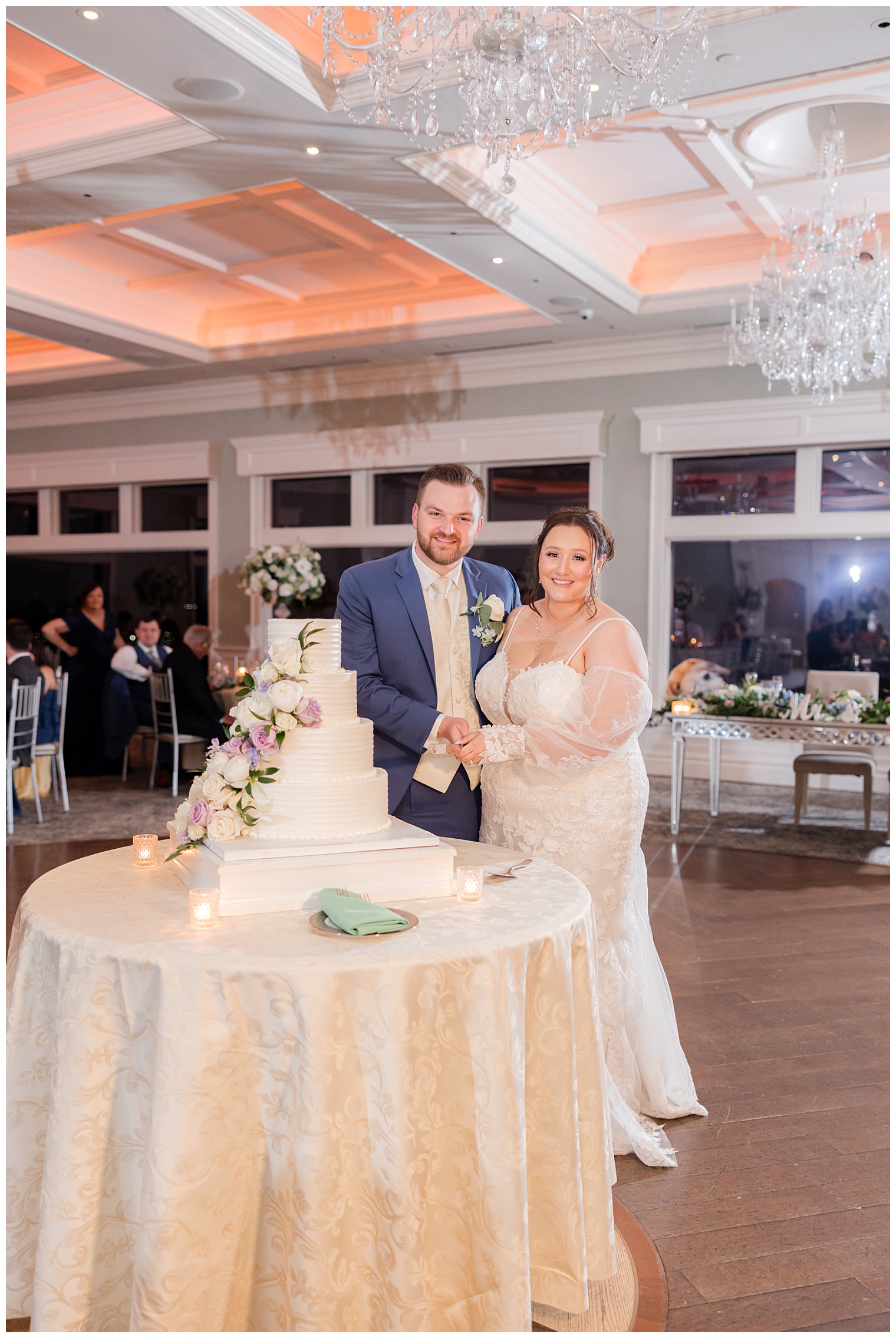 bride and groom cutting the wedding cake