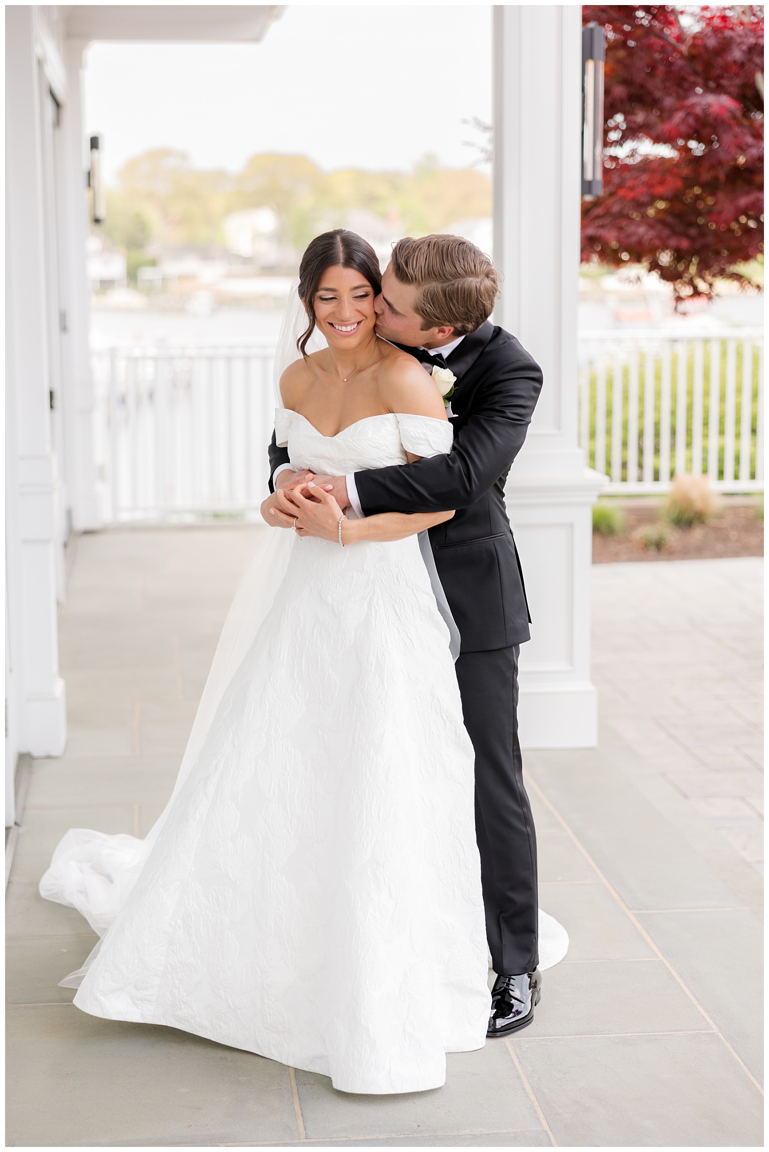 groom hugging the bride