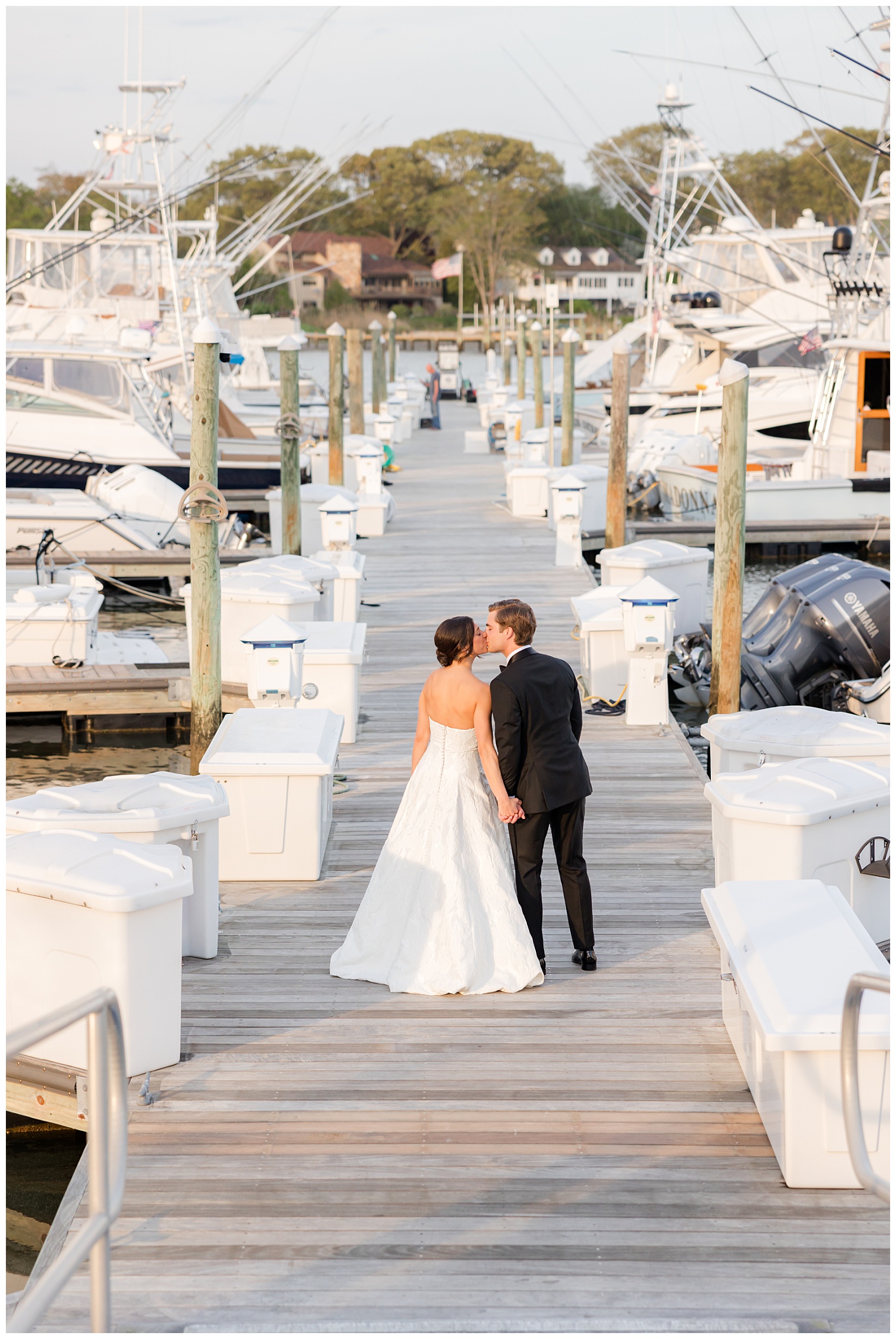 bride and groom walking at yacht club