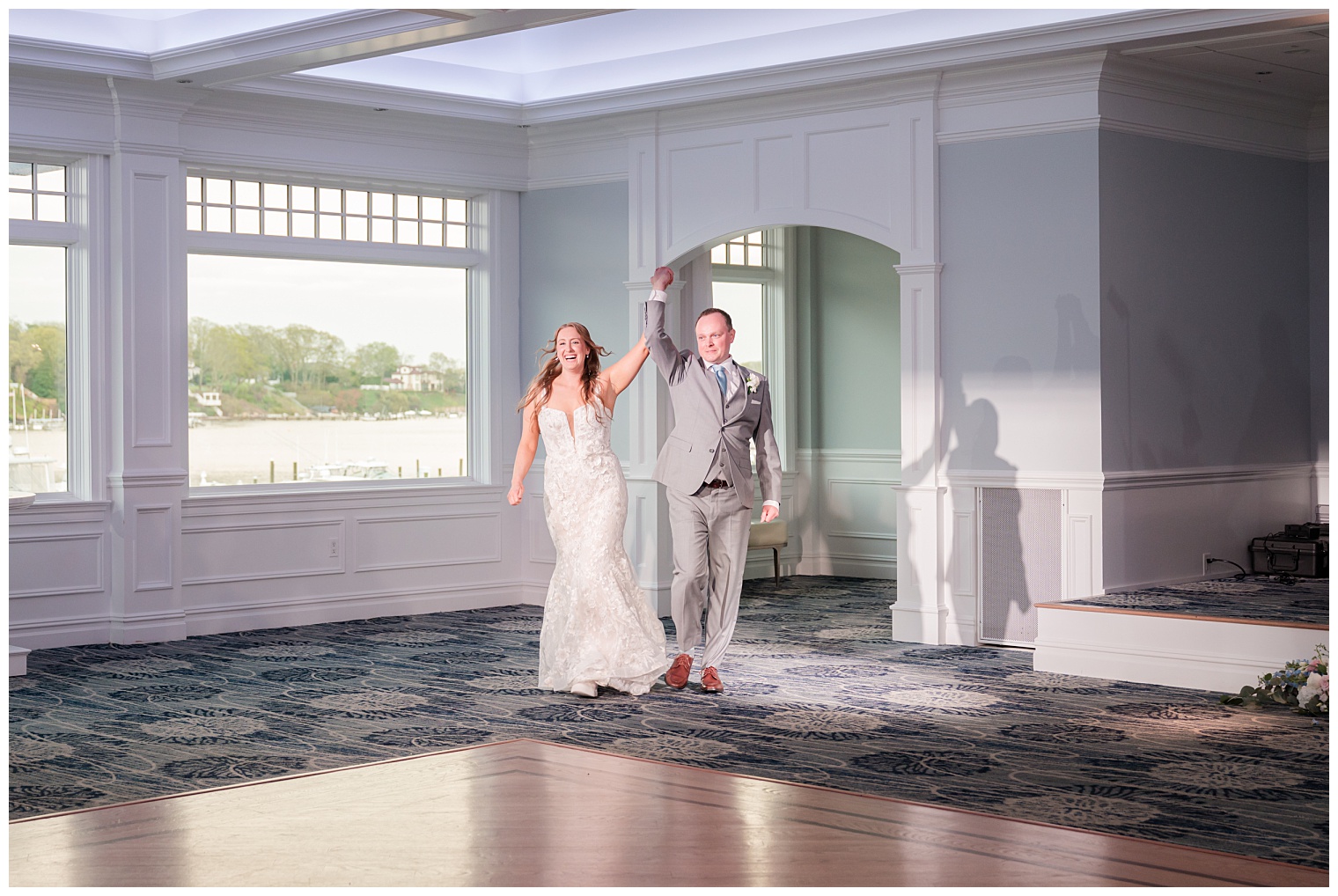 bride and groom entering the ballroom
