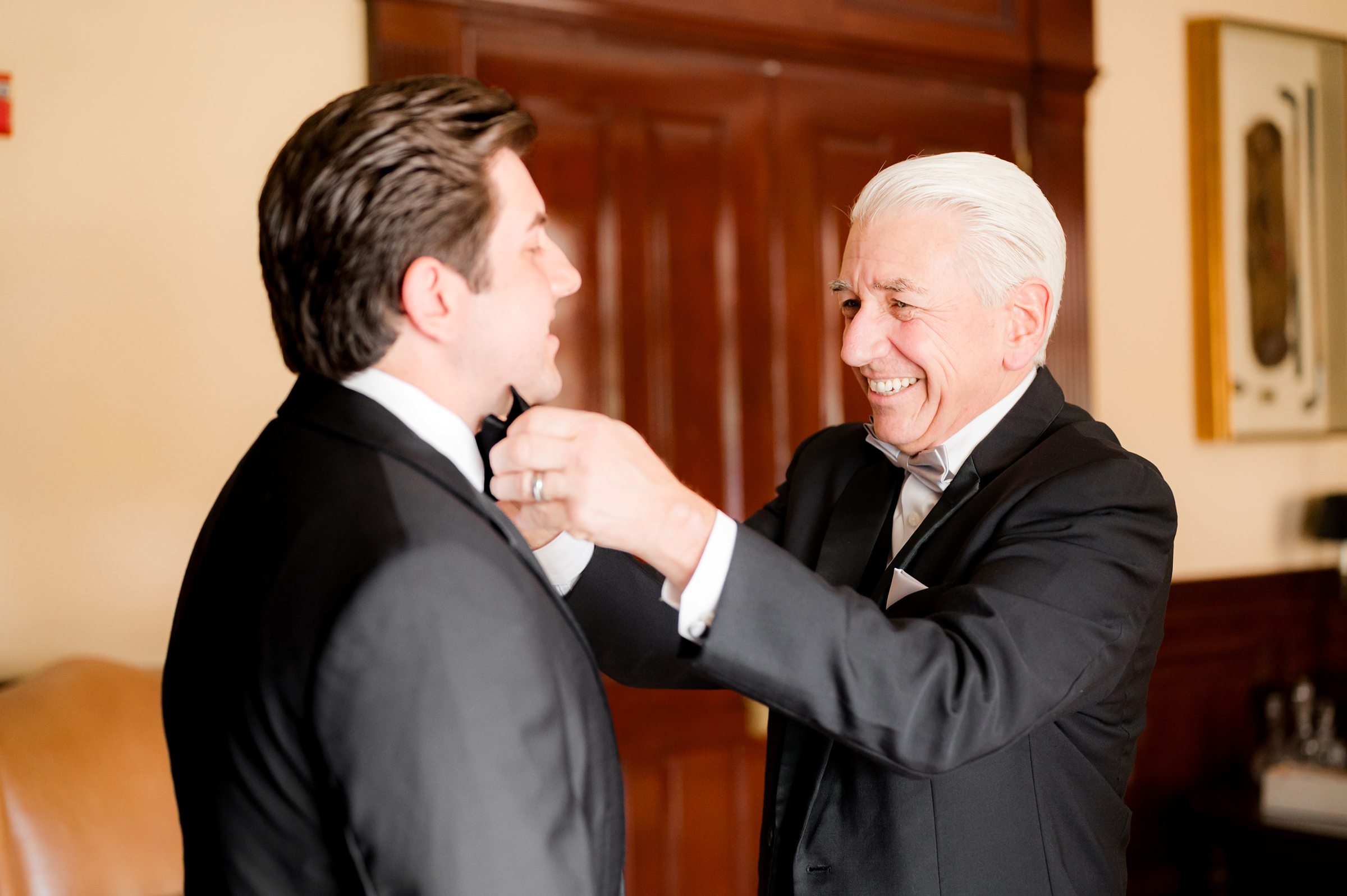 Groom getting ready with dad