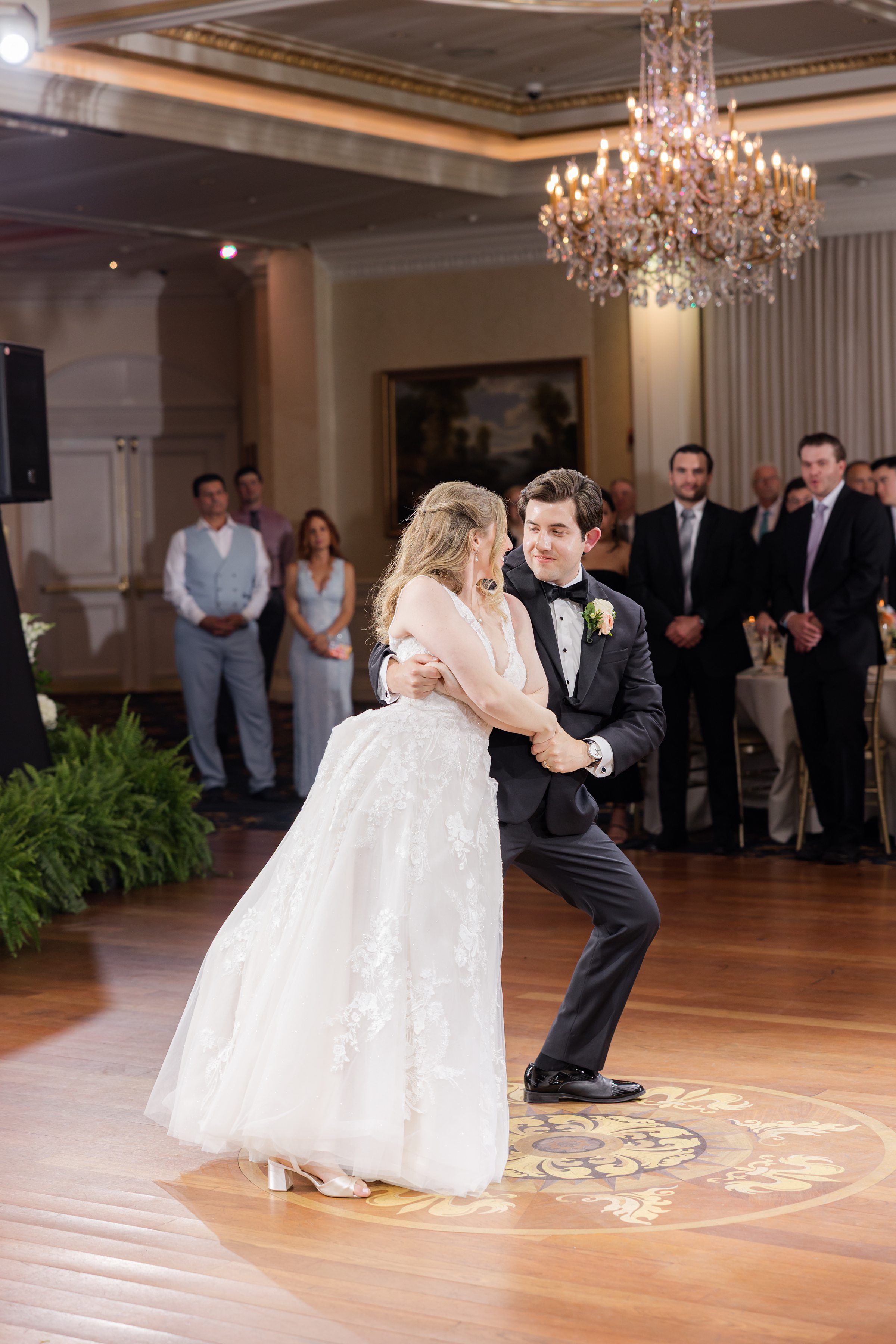 Bride leaning towards the groom during first dance