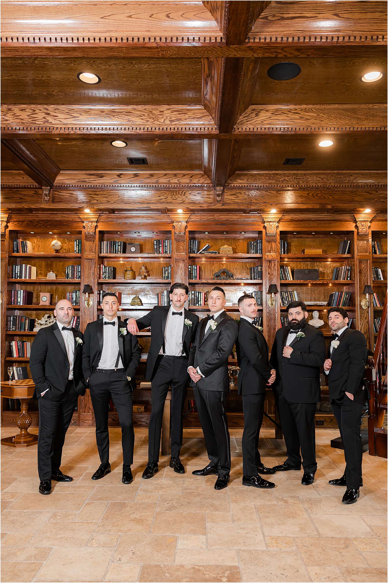 groomsmen posing for photos in library at Ashford Estate in Allentown NJ